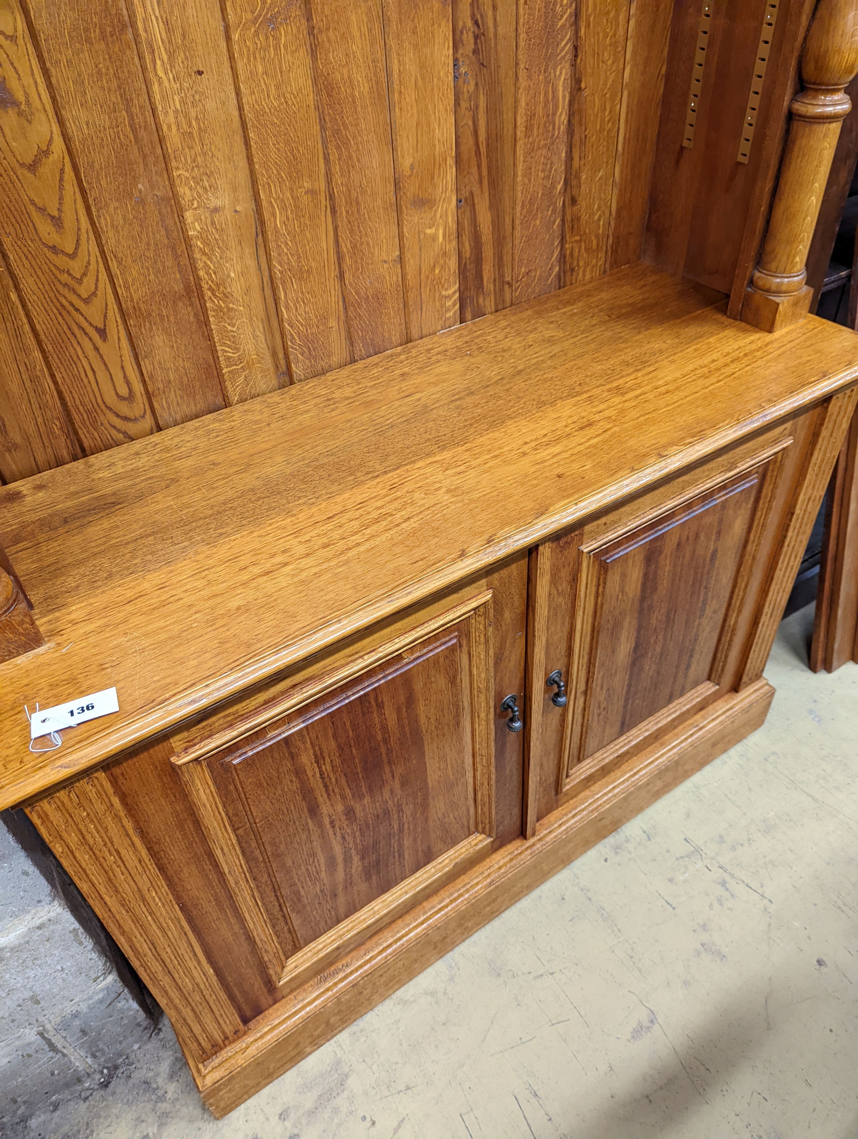 A Victorian style pale oak open bookcase, length 122cm, depth 46cm, height 229cm